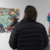 Visitors viewing original canvas artwork created by Just by Juliana at art display