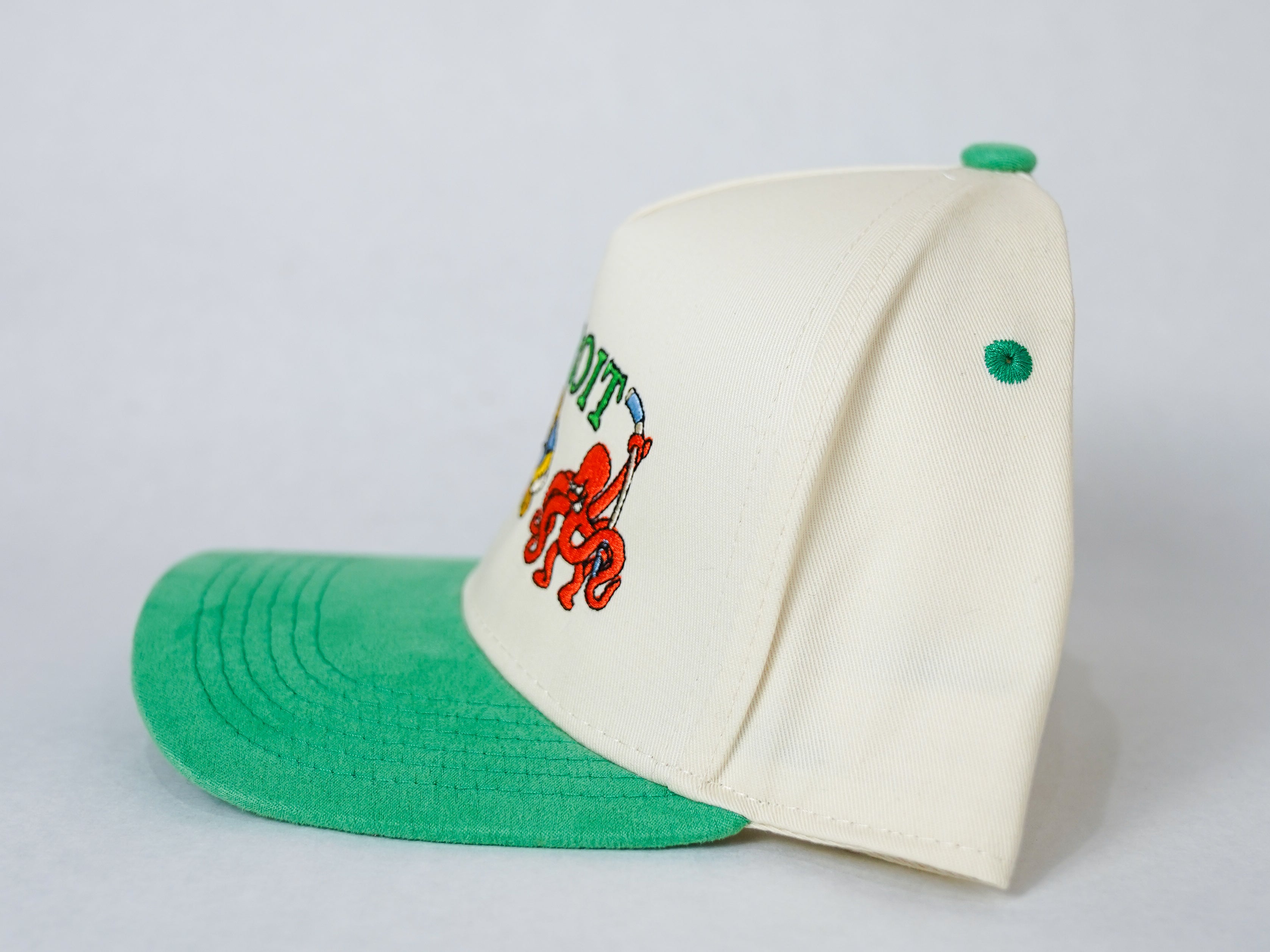 Side view of Kelly Green Sport City Detroit wearable art hat by Just by Juliana